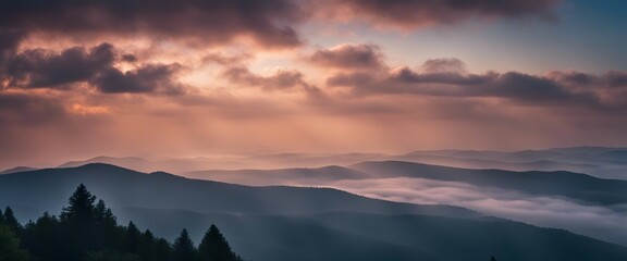 Fototapeta premium sunrise view over the foggy mountains 