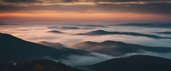 Obraz premium sunrise view over the foggy mountains 