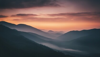 Fototapeta na wymiar sunrise view over the foggy mountains 