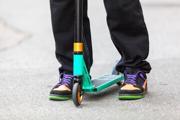 Stunt scooter, close-up with legs
