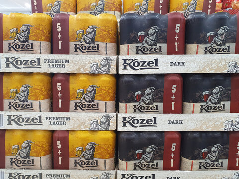 BUCHAREST, ROMANIA - DECEMBER 06, 2023. Kozel beer, dark and premium lager, packs of six cans
