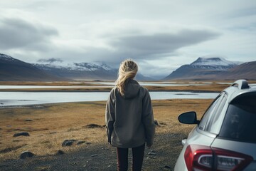 beautiful woman enjoying her trip to Iceland from a car