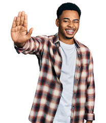 Young african american man doing stop sign with hand winking looking at the camera with sexy...