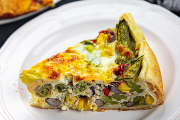 open pie quiche vegetable savory baked corn, green peas, beans, green beans, bell pepper healthy eating cooking appetizer meal food snack on the table copy space food background