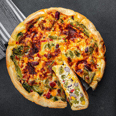 open pie quiche vegetable savory baked corn, green peas, beans, green beans, bell pepper healthy eating cooking appetizer meal food snack on the table copy space food background