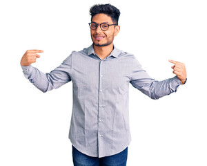Handsome latin american young man wearing business clothes and glasses looking confident with smile...