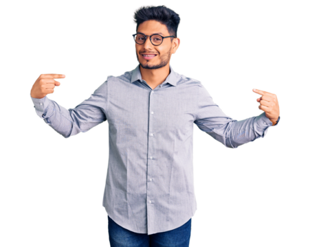 Handsome latin american young man wearing business clothes and glasses looking confident with smile on face, pointing oneself with fingers proud and happy.