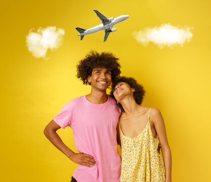 Happy couple are thinking about traveling by plane for a vacation