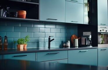 Details of a moden designer kitchen with black countertop. Home interior design ideas