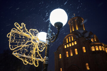 street lamp in the snowy night park