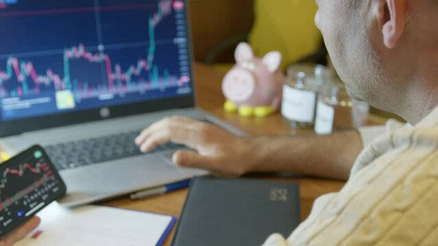 Senior man analyzing stock market charts. Day trading or investment decision concept. High quality 4k footage
