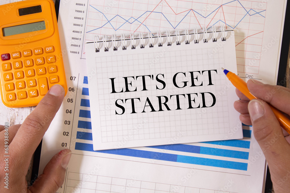 Poster job interview concept . office table top view. notepad, pen and reminder with word let's get started
