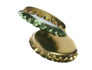 Two new golden bottle cap for beer in flying, isolated on white, clipping path, macro