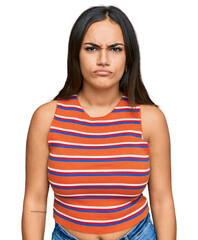 Young brunette woman wearing casual clothes skeptic and nervous, frowning upset because of problem....