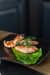 Fried chicken breast with salad and herbs