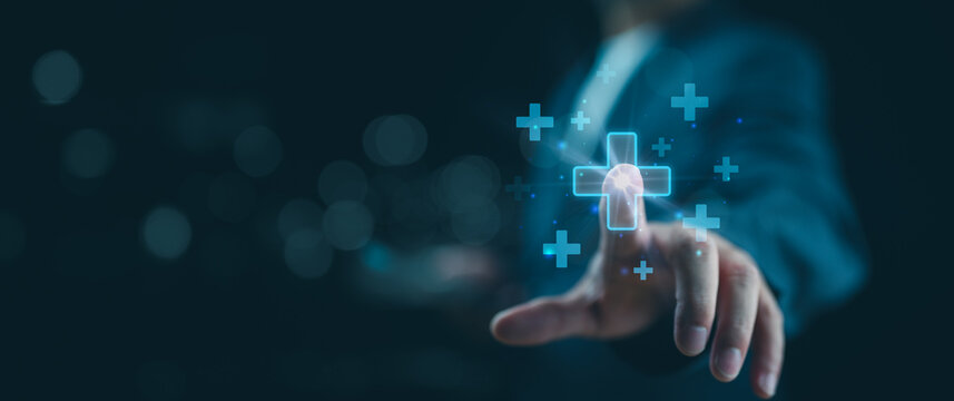 Businessman touching on virtual blue plus sign for positive thinking mindset or healthcare insurance symbol concept, Mental health care, mental rejuvenation.