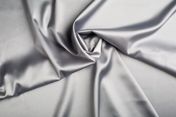 Smooth elegant grey silk or satin luxury cloth background.