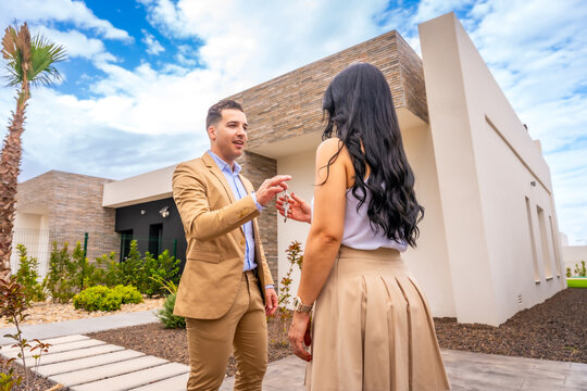Woman receiving the keys of a new house