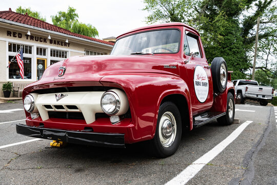 restored pickup truck of the 50s Ford F-100 advertises local cafe.