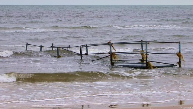 Damaged pier after flood storm in Ishoj Denmark 20 October 2023 Koge bugt