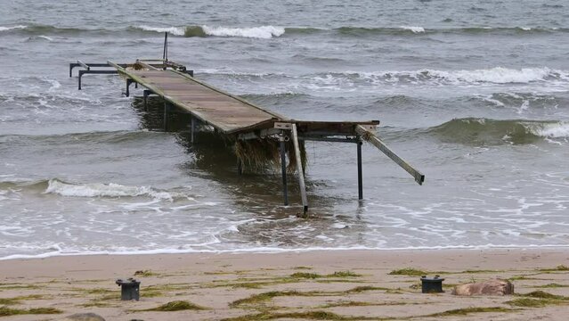 Damaged pier after flood storm in Vallensbaek Denmark 20 October 2023 Koge bugt,	