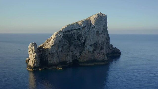 Aerial drone view of Foradada island near Capo Caccia cape in Sardinia, Italy