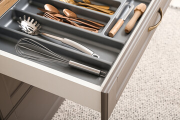 Open kitchen drawer with different cutlery - obrazy, fototapety, plakaty