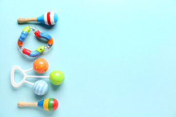 Baby rattles on blue background