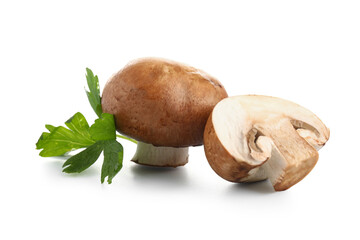 Raw champignon mushrooms with parsley on white background