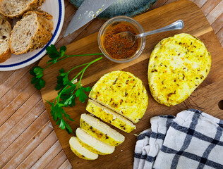 Slices of delicious baked cottage cheese flavored with aromatic turmeric and cumin served for...