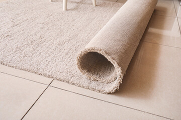 Close up of rolled beige carpet