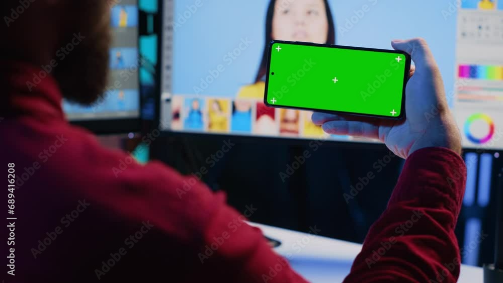 Poster photo editor using green screen mobile phone to watch tutorial, learning to color correct photograph