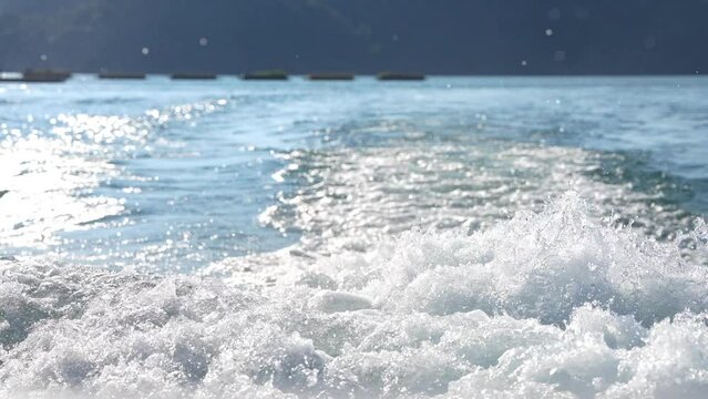 White bubble and water wave. Clean white foam splash around on the water sea.