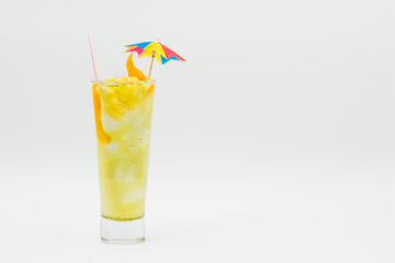 Cocktail drink with orange, straw and umbrella isolated on white background.