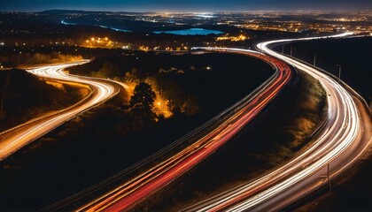Obraz premium Nighttime long exposure on highway - photo capturing light trails
