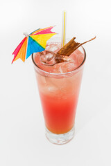 Cocktail with paper umbrella and cinnamon, aerial view.