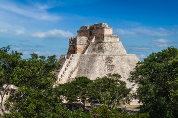 Fototapeta na wymiar Ancient Mayan pyramid (Pyramid of the Magician Adivino) in Uxmal, Merida, Yucatan, Mexico