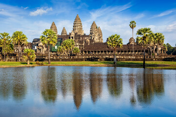 Famous Cambodian landmark and tourist attraction Angkor Wat with reflection in water. Cambodia, Siem Reap - 689424272
