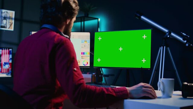 Photo editor using mockup PC monitor to color correct photographs in creative media agency. Photographer selecting best pictures for editorial content with isolated screen computer display