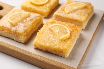 Fototapeta na wymiar Tasty lemon bars on white table, closeup