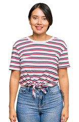 Fototapeta premium Beautiful young woman with short hair wearing casual clothes with a happy and cool smile on face. lucky person.