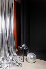 Silver holiday background. photo zone with silver fabric and gifts. Christmas decoration