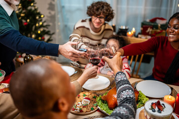 Fototapeta na wymiar Multi-ethnic family celebrating Christmas party together in house. 