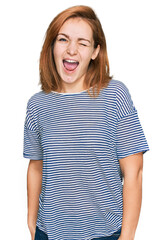 Fototapeta premium Young caucasian woman wearing casual clothes winking looking at the camera with sexy expression, cheerful and happy face.