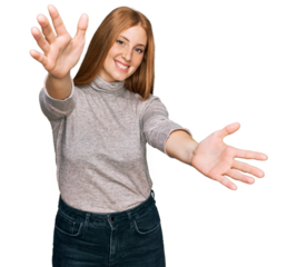 Young irish woman wearing casual clothes looking at the camera smiling with open arms for hug. cheerful expression embracing happiness.