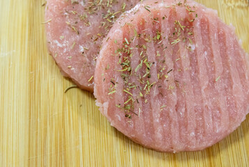 Fresh chicken burger flavoured with herbs provence