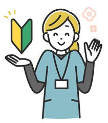 初心者マークを持った女性医療スタッフ