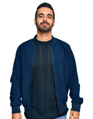 Obraz premium Young hispanic man wearing casual clothes relaxed with serious expression on face. simple and natural looking at the camera.