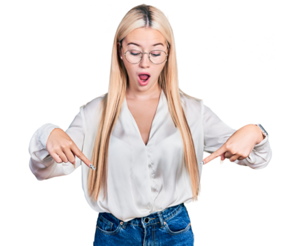 Beautiful blonde woman wearing elegant shirt and glasses pointing down with fingers showing advertisement, surprised face and open mouth