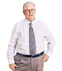 Senior grey-haired man wearing business clothes winking looking at the camera with sexy expression,...